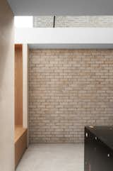 The pale brick wall strengthens the visual connection between indoors and out. 