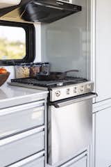 Owners can upgrade their Living Vehicle with the Chef's Kitchen package that includes a marine-grade stainless steel oven/stove combo. The oven, furnace, and water heater are the only items that run off of propane instead of electricity.