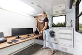 With the Mobile Office package, owners can easily fold up the queen bed into the wall to reveal an 80-inch-long walnut desk surface and white board.