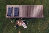The tiny home’s metal roof is topped with solar panels that power all the 12-volt fixtures, from the energy-efficient RYET LED bulbs to the solar fridge. 