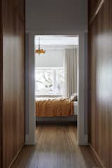 The architects moved the front door from behind the main bedroom to the side entry and converted the old entrance into a new walk-in wardrobe and en suite bedroom. 