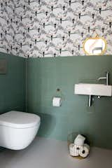 No Fred wallpaper adds a touch of whimsy in the children's bathroom. 