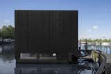 Exterior, House Building Type, Wood Siding Material, and Gable RoofLine  Photos from An Off-Grid Floating Home Brings the All-Black Aesthetic to the Canals of Amsterdam