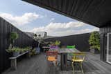 Outdoor, Wood Patio, Porch, Deck, and Large Patio, Porch, Deck  Photos from An Off-Grid Floating Home Brings the All-Black Aesthetic to the Canals of Amsterdam