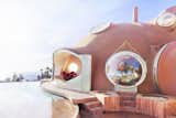 Exterior, Concrete Siding Material, House Building Type, and Curved RoofLine The window pictured here next to the pool slides down to follow Lovag's concept of continuous circulation.  Photo 7 of 21 in Pierre Cardin’s Retro-Futuristic Bubble Palace in Cannes Is On the Market