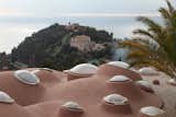 Exterior, Curved RoofLine, Concrete Siding Material, and House Building Type Skylights inserted into the tops of the domes can be opened up for access to the roof.  Photo 20 of 21 in Pierre Cardin’s Retro-Futuristic Bubble Palace in Cannes Is On the Market