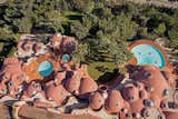 Exterior, House Building Type, Curved RoofLine, and Concrete Siding Material The French Ministry of Culture has listed Le Palais Bulles among its national historic monuments since 1999.  Photo 21 of 21 in Pierre Cardin’s Retro-Futuristic Bubble Palace in Cannes Is On the Market