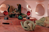 Living Room, Chair, Marble Floor, and Sofa A peek inside the large living room furnished with custom fabric furniture built by Claude Prévost.  Photo 11 of 21 in Pierre Cardin’s Retro-Futuristic Bubble Palace in Cannes Is On the Market