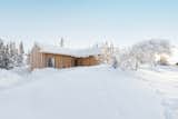 Norwegian architect Erling Berg designed the 1,560-square foot Kvitfjell Cabin high in the Kvitfjell Mountains for a family of passionate skiiers. The design brief called for a relatively compact build. "A big goal for this project was to reduce the size of the cabin’s footprint as much as possible to keep the construction costs down, while meeting programmatic needs for four bedrooms, two bathrooms, a sauna, and a spacious, open living and dining room connected to a kitchen," Berg says.