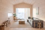 After years of working at Oslo- and San Francisco–based Mork Ulnes Architects, Norwegian architect Erling Berg recently launched his own practice—and his first project is a cozy cabin with a minimalist Scandinavian aesthetic and a thoughtful eco-sensitive design.&nbsp;The cozy living area features a refurbished Børge Mogensen chair, a Recover sofa from Bolia, and a coffee table from Jotex.