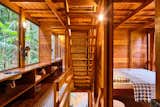 Garapera, a tropical hardwood, is used extensively throughout the cabin, including the ceilings, floors, walls, stairs and exterior for a unified appearance.