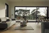Large windows let in an abundance of natural light, provide views of the landscape. 
