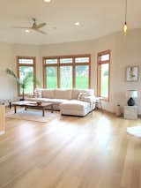 Living Room, Sectional, Pendant Lighting, and Medium Hardwood Floor  Photo 3 of 16 in Modern Craftsman Style Home by La Bar Properties, Inc