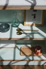 Kitchen shelves detail, in mint green and birch plywood.