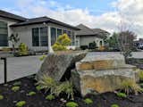 The boulder grouping makes a bold focal point without taking away from the home's dramatic entrance.
