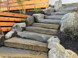 Stone slab steps were custom fabricated locally for the backyard path.