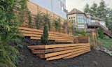 The walls are juniper timbers that were painted black and then clad with cedar deck boards for a light and modern look.