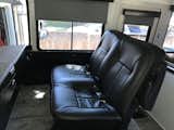 This is the original two-passenger front seat from RevCon, reupholstered to match the leather driver's seat.  Photo 14 of 23 in Flatnose Frank: Our Renovated Vintage RevCon Motorhome ("Is that an Airstream?") by Brad Johnson