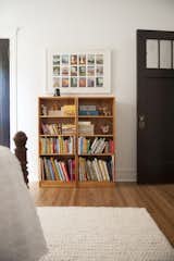 Kids Room, Bedroom Room Type, Bookcase, Medium Hardwood Floor, Rug Floor, Pre-Teen Age, and Neutral Gender  Photos from Simple and Beautiful Chicago Family Apartment