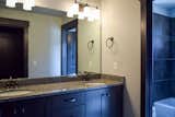 Bath Room, Ceramic Tile Floor, Granite Counter, Undermount Sink, Alcove Tub, Full Shower, Wall Lighting, and Two Piece Toilet Guest Bathroom  Photo 8 of 17 in The Conley Home by Nikki Brothers Keye