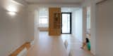 Dining Room, Table, Chair, Wall Lighting, Medium Hardwood Floor, and Corner Fireplace Dining room  Photo 18 of 20 in CM House by EXiT architetti associati