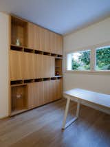 Office, Study Room Type, Bookcase, Storage, and Medium Hardwood Floor Home office  Photo 5 of 20 in CM House by EXiT architetti associati