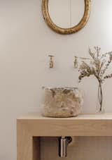  In the main bedroom there is a bespoke vanity in oak with a basin crafted from locally sourced stone