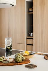Oak panelling conceals the kitchen storage spaces

