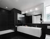 The bathrooms feature a monochrome aesthetic. 