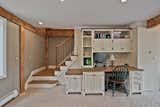 A built in desk by the homeowners dad is highlighted with the new ceilings and brighter lighting. 