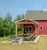 Timber framed covered patio creates a cozy place to sit in the sun or the shade for family gatherings