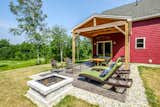 Exterior Relax on the patio or at the table in the shade.  Photo 8 of 35 in The Red Barn Home by Mottram Architecture
