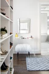 Shelving provides many of the same storage functions as drawers or baskets, but at a more economical price point. Items on open shelves are easier to recognize as a match for an outfit than items inside drawers. Top shelves are best for large, lightweight and seldomly-used items like your favorite floppy beach hat. Middle shelves, which tend to be the units focal point can be personalized with photos and home decor. Bottom shelves provide easy access to your most frequently used items like cozy sweaters and beloved slacks.

This custom closet also includes three tilt-out laundry hampers. No more dragging big clunky laundry baskets around the house.  Tilt-out hampers are removable, lightweight nylon bags and easy to grab and go. They are stored behind cabinet faces that blend in with your space, removing unsightly and unpleasant-to-be-around dirty laundry from accumulating in piles on the floor. Installing 2 - 3 tilt-outs will make sorting laundry lightning fast. These hampers help keep your closet clean and tidy and increase space without losing functionality.
