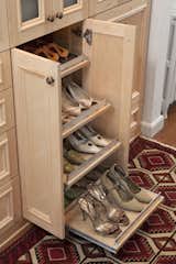 A pull-out shoe shelves were added in so they have an organized place to display footwear. No need to pile them on top of each other, and gone are the days not being able to see what you have or find matching pairs. 