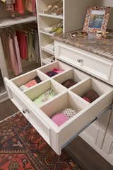 Spacious, custom designed, divided closet drawers.