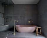 Soft northern light washes over the velvet-like finish of the tub and tile surround.