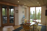 Dining room with doors to front deck, screened porch.