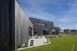 Exterior, Flat RoofLine, House Building Type, Stucco Siding Material, and Wood Siding Material  Photo 14 of 17 in Silky Black House by Joris Verhoeven Architectuur