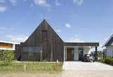 Exterior, House Building Type, Shingles Roof Material, Shed RoofLine, and Wood Siding Material streetview  Photo 3 of 12 in Fungi House by Joris Verhoeven Architectuur