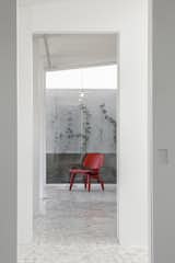 Living Room, Ceiling Lighting, Chair, Pendant Lighting, and Travertine Floor Hallway  Photos from Casa Verne