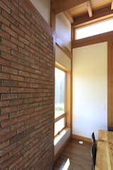 Salvaged brick for the original house was re-purposed in the eating and entry areas to add both texture and an additional element of time to the house.