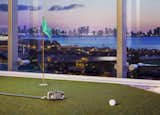 A skylight turf with a green area is perfect for putting practice.  Photo 11 of 13 in $35 Million Oceanfront Penthouse by Sofia Joelsson