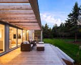 Outdoor, Horizontal Fences, Wall, Grass, Front Yard, Landscape Lighting, Decking Patio, Porch, Deck, Metal Patio, Porch, Deck, Small Patio, Porch, Deck, Wood Patio, Porch, Deck, Metal Fences, Wall, and Wood Fences, Wall ModHaus I    Photo 2 of 5 in ModHaus 1 by Nicholas Fudge Architects
