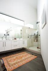 Bath Room, Engineered Quartz Counter, Medium Hardwood Floor, Drop In Sink, Open Shower, Corner Shower, Recessed Lighting, and Porcelain Tile Wall  Photo 12 of 38 in Homeside House | HMDG Inc. by REAL ESTATE COLLECTIVE | Claire Lissone