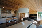 Kitchen, Refrigerator, Cooktops, Dishwasher, White Cabinet, Concrete Floor, Recessed Lighting, Undermount Sink, and Laminate Counter  Photo 5 of 7 in O'Connor cabin by Paul McKean Architecture llc