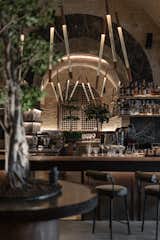 The open kitchen occupies an impressive part of the restaurant; edged with a long bar counter which seems to cover a significant part of the seats. 
