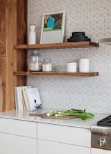 Cabinetry and floating shelves by Kaimade, Heath Ceramics wall tile