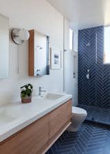 Master bathroom tile is Shark Gray by Heath Ceramics, Vanity and medicine cabinets by Wetstyle, Workstead wall sconce