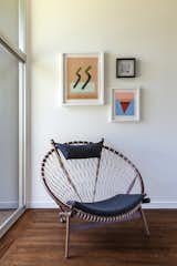 A net lounge chair from HD Buttercup creates a cozy corner for relaxing in the sun.