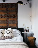 Bedroom, Bed, Wall Lighting, and Dark Hardwood Floor  Search “hono-electric-candle-led-light.html” from Big Bear A-Frame Receives Boho Eclectic Transformation